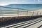 Railing aside a pathway near a beach