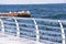 Railing in icicles on a pier by the sea.