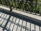 Railing and shadows, bridge over Napa Creek