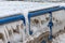 Railing on the shore of Lake Michigan covered with ice