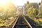 Railroad against beautiful sky at sunset. Rural landscape with railway station.