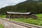 Railroad along the river Mur and an ancient wooden bridge, Austria, alpine landscape