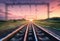 Railroad and beautiful sky at sunset with motion blur effect