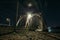 Railroad bridge over river at night, transportation construction