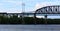 Railroad and car bridges over Hudson River at Schodack State Park. Freight train passing through.