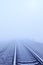 Railroad closeup to horizon in fog