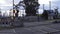 A railroad crossing with the gate closing as a commuter metro train passes through a railway level crossing in Australia