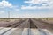 Railroad crossing gates on a road in the Mojave Desert