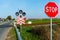 Railroad crossing and stop sign in farmland ralway level crossing with warning sign stop outdoor evening