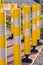 Railroad crossing yellow safety tubes reflecting the sunrise