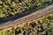 Railroad into dark deep forest aerial