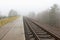 Railroad goes into the mist. gray misty autumn morning.