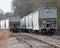 Railroad hopper cars on siding await unloading