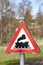 Railroad Level Crossing Sign without barrier or gate ahead the road, beware of train roadside steam engine locomotive signage road