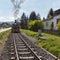 Railroad locomotive on rails in spring