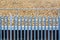 Railroad metal fence over gravel background in england uk