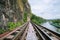 Railroad and mountain views by the river and the sky behind Thailand.