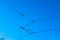 Railroad overhead lines against clear blue sky Contact wire