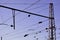 Railroad overhead lines against clear blue sky, Contact wire. High voltage railroad power lines on neutral blue sky backgroun