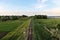 railroad passing through green fields