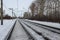 Railroad rails stretching distance the path for the train snowbound in the winter