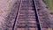 Railroad. Railway tracks from moving train. Travelling background.