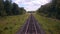 Railroad. Railway tracks from moving train. Travelling background.