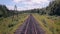 Railroad. Railway tracks from moving train. Travelling background.