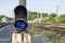 Railroad signal with blue light with a railroad junction. Train blue traffic light prohibiting traffic. Railway junction. Heavy