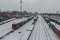 Railroad station in winter. Freight cars and platforms are covered with snow. The concept of railroad transportation