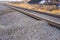 Railroad track on a dry and rocky ground