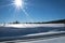 Railroad track near the mountain called Brocken with lens flare