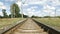 Railroad track in perspective on blue sky