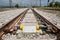 Railroad tracks closeup with derailing block