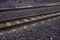 Railroad tracks on a cushion buried under rock shards