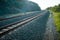 Railroad tracks on a cushion buried under rock shards