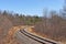 Railroad tracks leading to bend