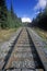 Railroad tracks leading to a snowy mountain off of Seward Highway in Kenai Peninsula, AK