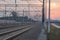 Railroad Tracks and Overhead Power Supply at Sunset