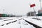 Railroad tracks in the snow. Commodity railway wagons, winter