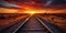 railroad tracks in the sunset. warm red and orange sunset sky over a vast Arizona desert. Railroad System, Trackway