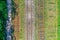 Railroad tracks with wooden sleepers and concrete, aerial view