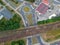 Railroad, train station in city, aerial view, road roundabout intersection with bridge