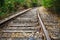 The rails of the railway go into the distance.