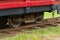 Rails and wheels of an old tourist tram close-up.