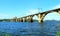 Railway arched bridge across the Dnieper River with a view of the Dnipro city