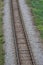 Railway bed. Fragment of railway tracks, top view, rails and sleepers