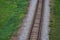 Railway bed. Fragment of railway tracks, top view, rails and sleepers