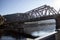 Railway bridge across the river in Russia. Travel through the mountains