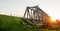 Railway bridge at dawn. Industrial summer landscape.